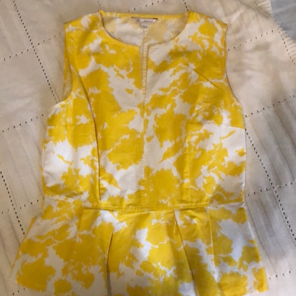 Sleeveless Top with Slit Neck and Box Pleats